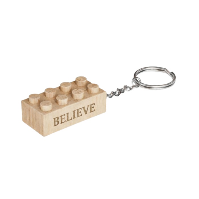 Believe Timber Brands engraved wooden brick keychain with “Believe” message, compatible with plastic brick systems