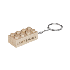 Timber Brands engraved wooden brick keychain with “Best Teacher” message, compatible with plastic brick systems