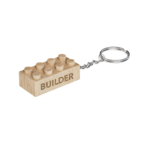 Timber Brands engraved wooden brick keychain with “Builder” message, compatible with plastic brick systems