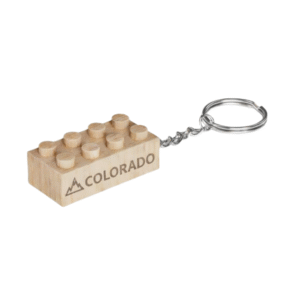 Timber Brands engraved wooden brick keychain with “Colorado” text and mountain icon, compatible with plastic brick systems