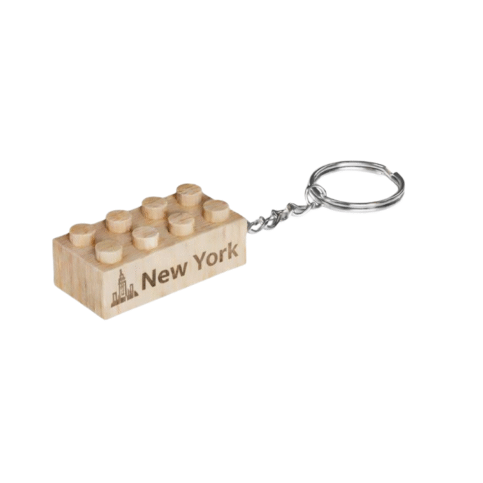 New York Timber Brands engraved wooden 2x4 brick keychain featuring the word "New York" and skyline icon, compatible with plastic brick systems
