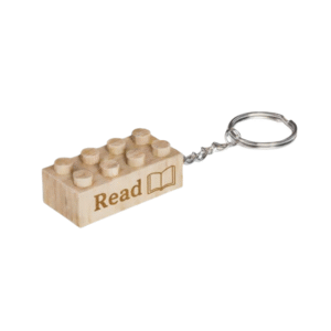 Timber Brands engraved wooden brick keychain with “Read” message and book icon, compatible with plastic brick systems