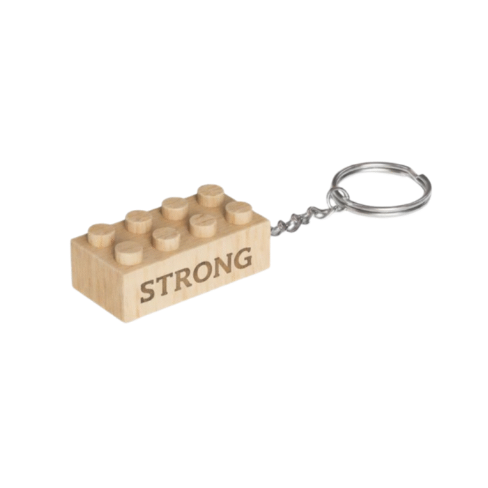 Strong Timber Brands engraved wooden brick keychain featuring the word Strong, compatible with Lego, plastic bricks, and minifigures.