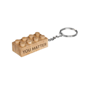 Timber Brands engraved wooden brick keychain with “You Matter” message, compatible with plastic brick systems