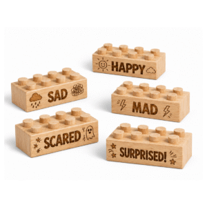 Custom engraved standard 2x4 wooden bricks featuring emotion words Happy, Sad, Mad, Scared, and Surprised with expressive icons. FSC-certified eco-friendly wood building blocks compatible with LEGO-compatible bricks and made in the USA for social-emotional learning and imaginative play.