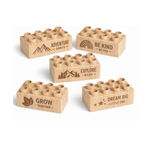 Custom engraved 2x4 plus size wooden bricks compatible with LEGO DUPLO featuring inspiring phrases including Adventure Awaits, Be Kind Be You, Explore More, Grow Together, and Dream Big Little One. FSC-certified eco-friendly wood building blocks made in the USA for imaginative play and positive learning.