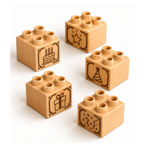 Set of five custom engraved wooden Plus bricks with birthday icon designs including cake, star, party hat, gift, and confetti
