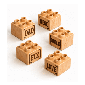 Set of five custom engraved wooden Plus bricks with dad word designs including "Dad," "Hero," "Build," "Fix," and "Love"