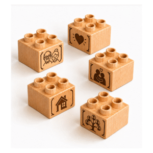 Set of five custom engraved wooden Plus bricks with grandparents icon designs including heart, family, house, and tree
