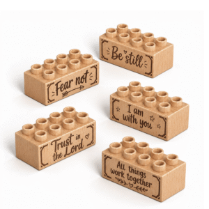 Set of five custom engraved wooden bricks with faith phrase designs including "Fear Not," "Be Still," "I Am With You," "Trust in the Lord," and "All Things Work Together"