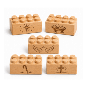 Set of five custom engraved wooden bricks with nativity icon designs including star, manger, angel wings, shepherd's staff, and cross