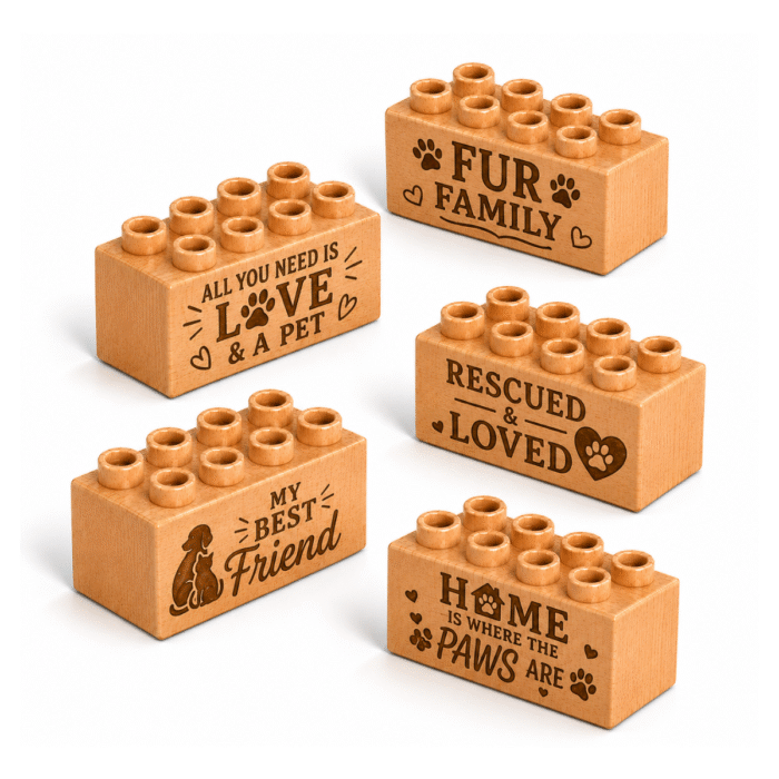 Set of five custom engraved wooden bricks with pet phrase designs including "Fur Family," "All You Need Is Love & a Pet," "Rescued & Loved," "My Best Friend," and "Home Is Where the Paws Are"