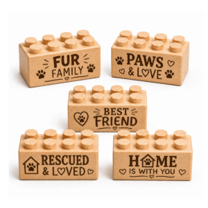 Set of five custom engraved wooden bricks with pet phrase designs including "Fur Family," "Paws & Love," "Best Friend," "Rescued & Loved," and "Home"