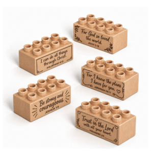 Set of five custom engraved wooden bricks with bible verse designs including "I Can Do All Things Through Christ," "For God So Loved the World," "Be Strong and Courageous," "For I Know the Plans I Have for You," and "Trust in the Lord With All Your Heart"