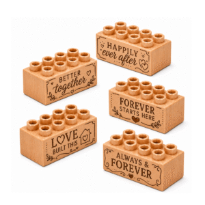 Set of five custom engraved wooden bricks with wedding phrase designs including "Happily Ever After," "Better Together," "Forever Starts Here," "Love Built This," and "Always & Forever"