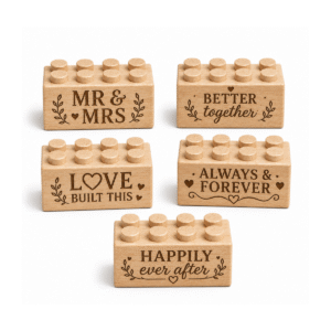 Set of five custom engraved wooden Plus bricks with wedding phrase designs including "Mr & Mrs," "Better Together," "Love Built This," "Always & Forever," and "Happily Ever After"