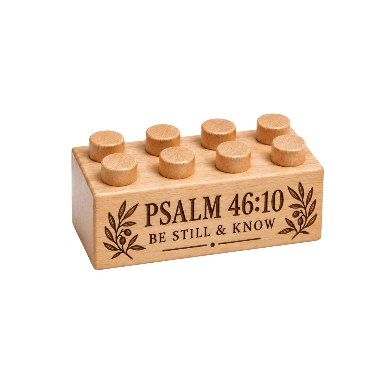 Wooden brick engraved with Psalm 46:10 and Be Still & Know, framed by olive branches.