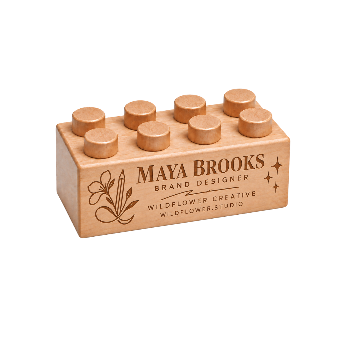 Wooden business card featuring a name, creative business branding, and decorative engraving.