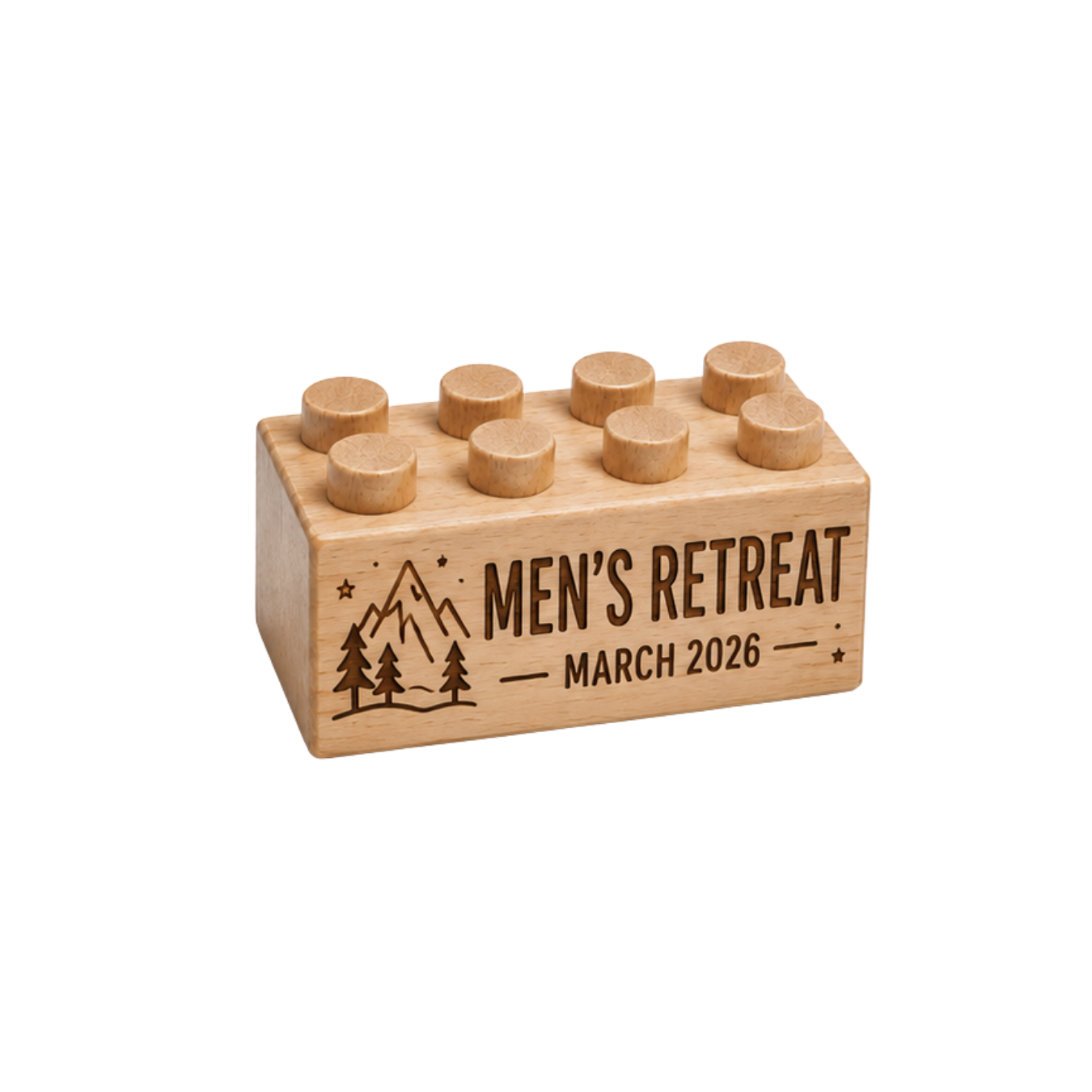 Wooden brick engraved with Men’s Retreat and March 2026, with mountains, pine trees, and stars.