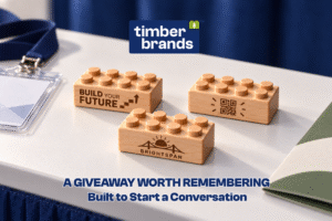 Engraved wooden bricks reading "Build Your Future," a QR code, and "Brightspan" company logo for career fair giveaway ideas.