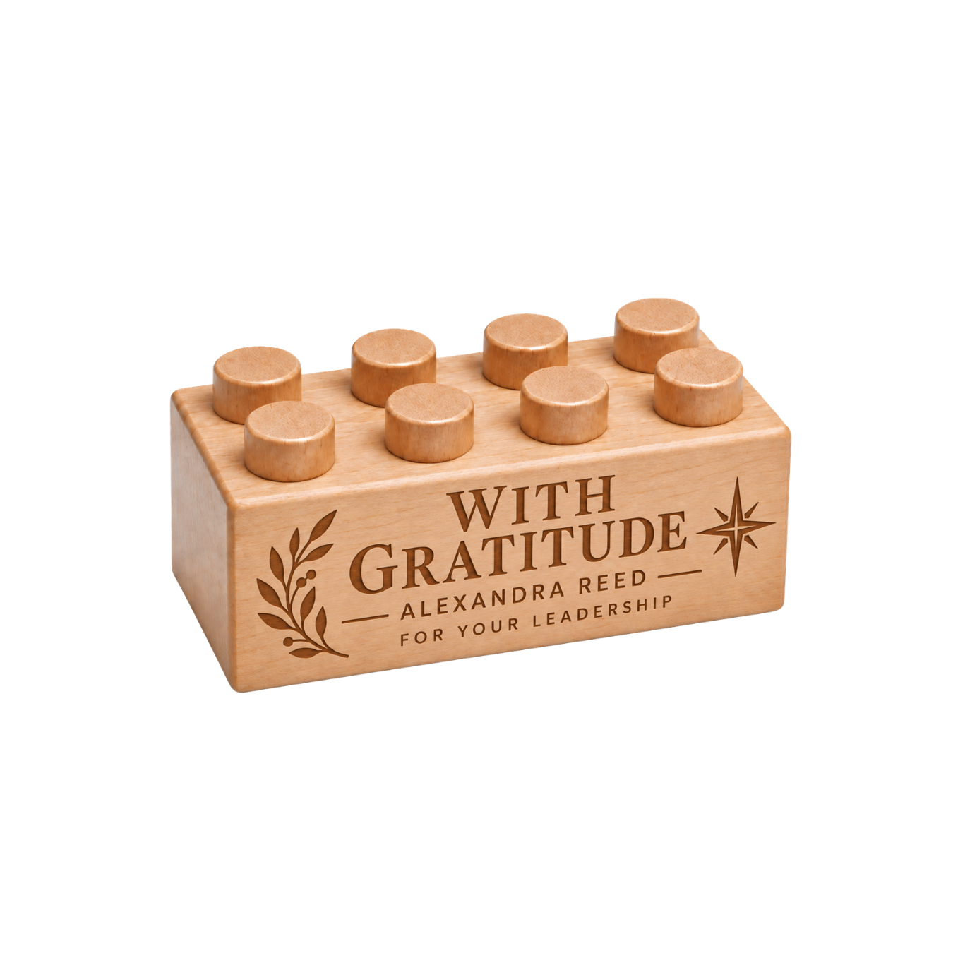 Wooden brick engraved with ‘With Gratitude,’ a recipient’s name and a message recognizing their leadership.