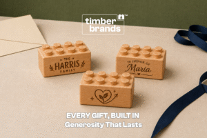 Engraved wooden bricks reading "The Harris Family," "In Honor of Maria," and a heart with a growing plant for fundraising and donor recognition gifts.