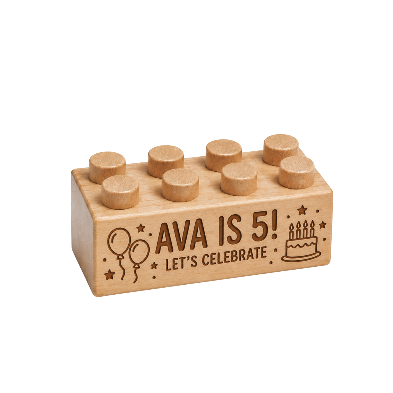 Wooden brick engraved with Ava Is 5! and Let’s Celebrate, with balloons, a birthday cake, and stars.