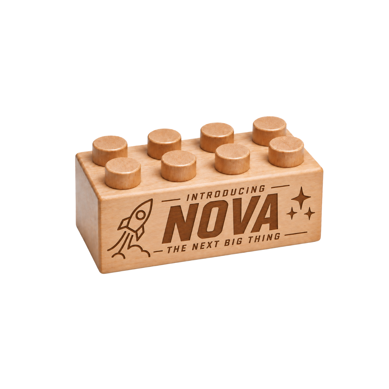 Wooden brick engraved with Introducing Nova and The Next Big Thing, with a rocket and stars.