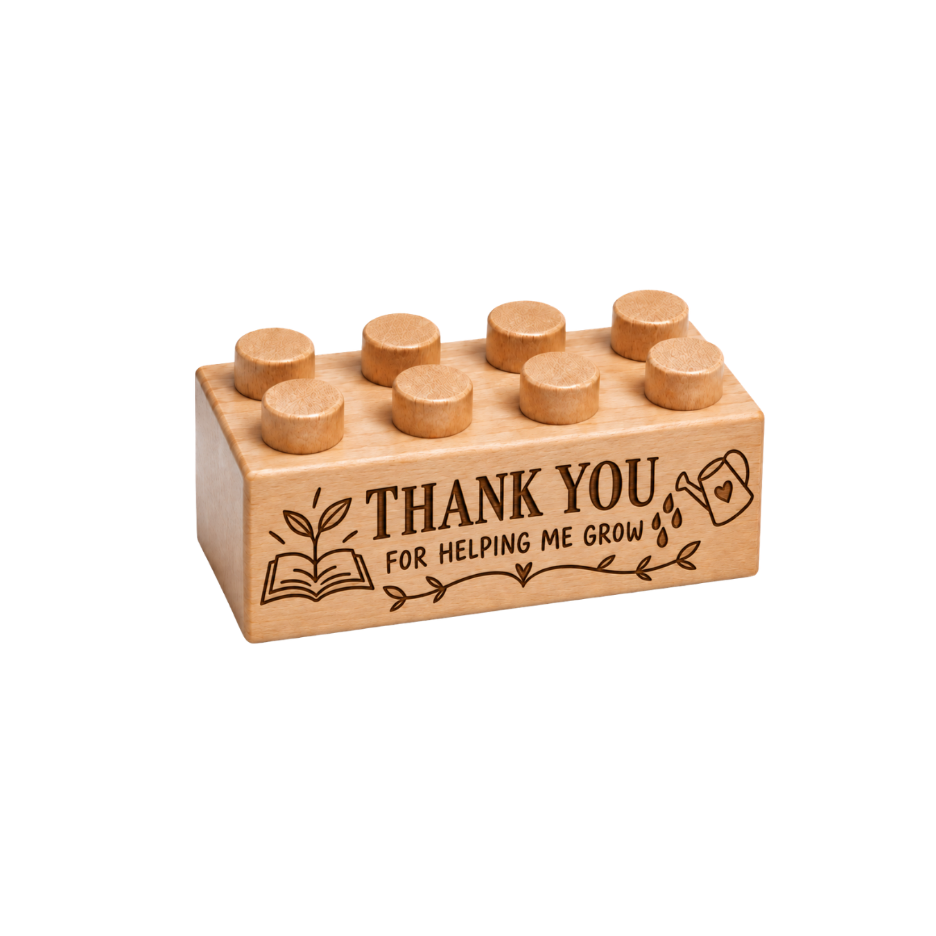 Wooden brick engraved with Thank You for Helping Me Grow, a sprouting book, and a watering can.