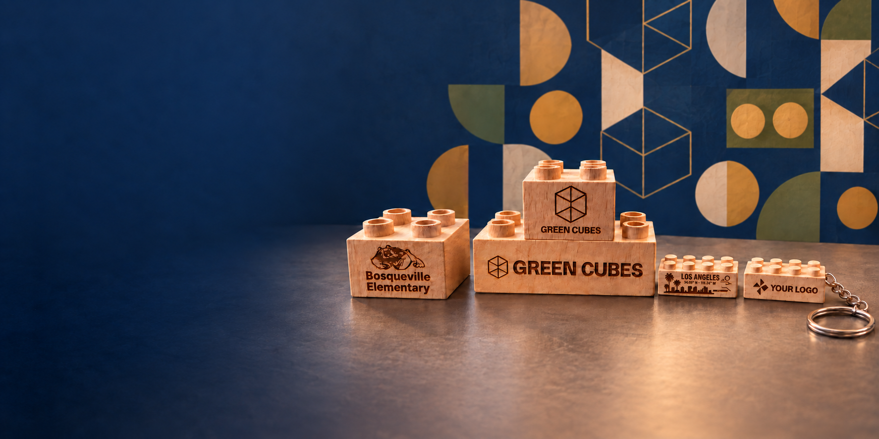 Custom engraved wooden bricks with school and business designs, a Los Angeles souvenir brick, and a wooden keychain.