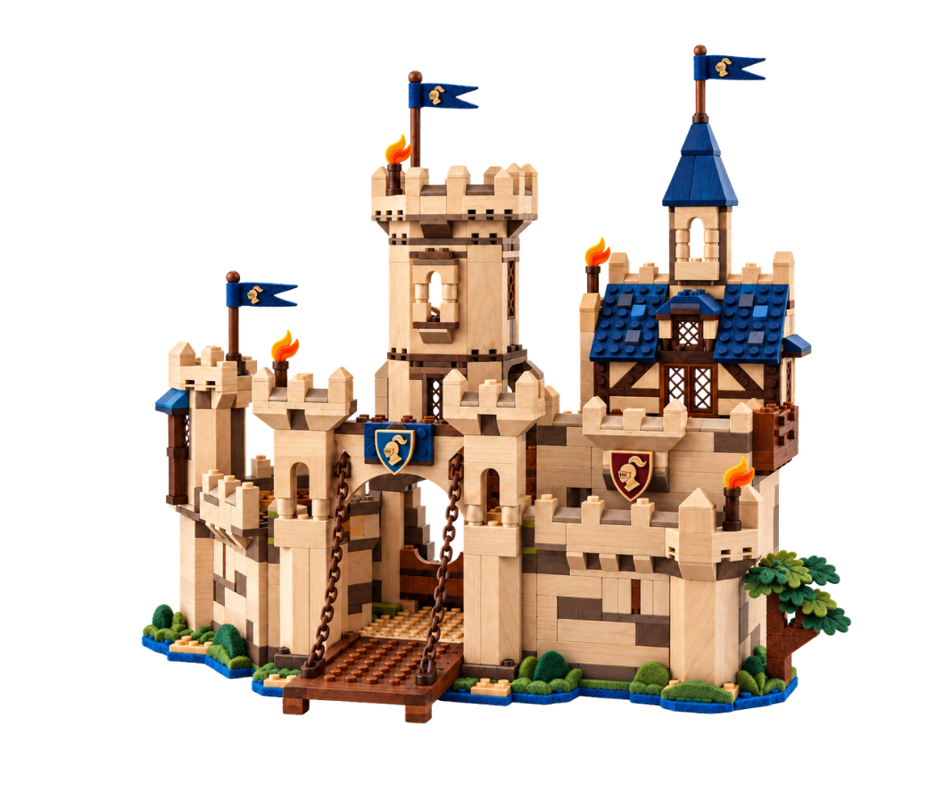 Wooden brick castle with towers, blue roofs, flags, shields, and a lowered drawbridge.